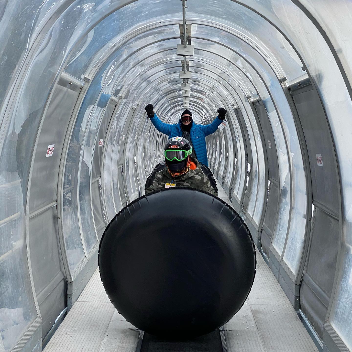Tubing at Keystone Colorado- you get to ride up the mountain on this magic carpet ride in an enclosed tunnel.  So no work to get back up the hill and great fun sliding down on tubes.  This was a great family activity and you get to ride up the mountain in the gondola. #keystonetubing #tubingfun #tubingincolorado #winteractivitiesforkids