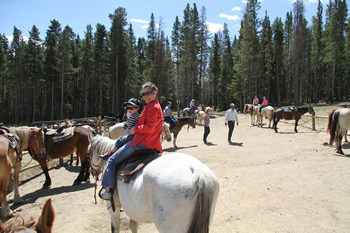 mother and child on horseback